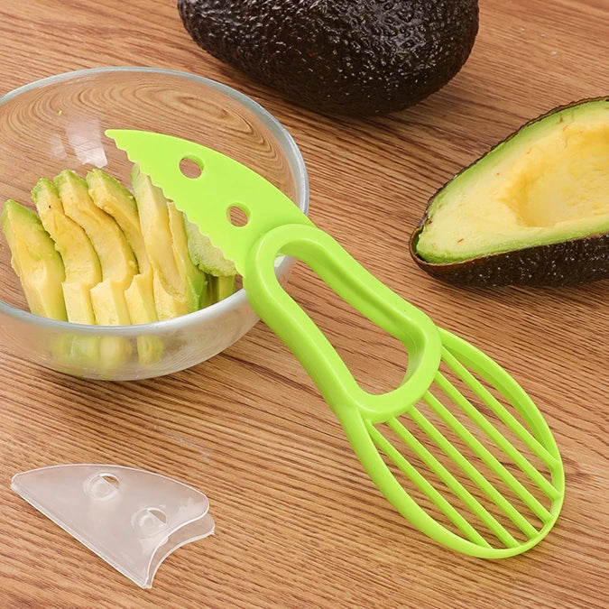 avocado slices in a bowl next to a avocado slicer