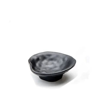 a black bowl on a white background