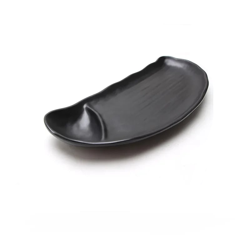 a black irregular oval form plate