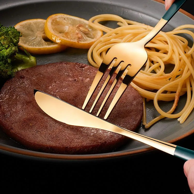 a fork and knife over a plate of food