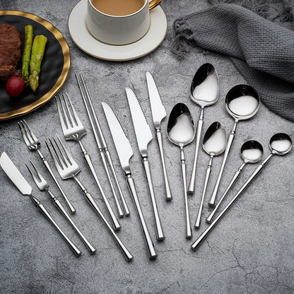 a full silverware set on a table