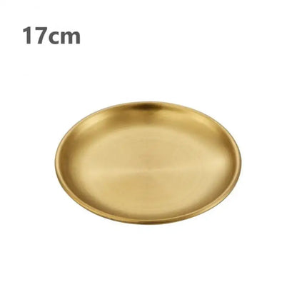 a gold stainless steel round plate with a white background 17 cm