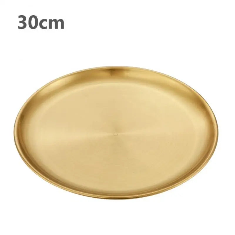 a gold stainless steel round plate with a white background 30 cm