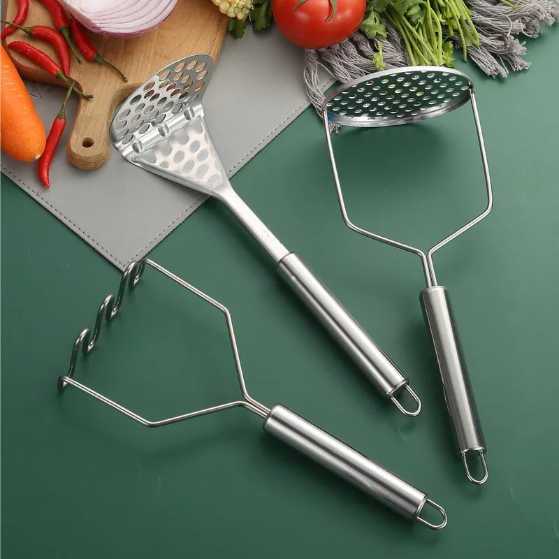 group of potato mashers next to vegetables