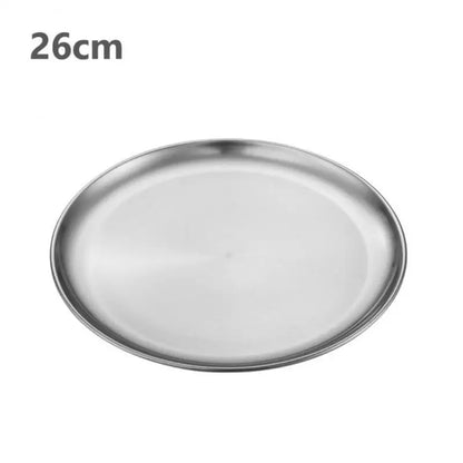 a silver stainless steel round plate with a white background 26 cm