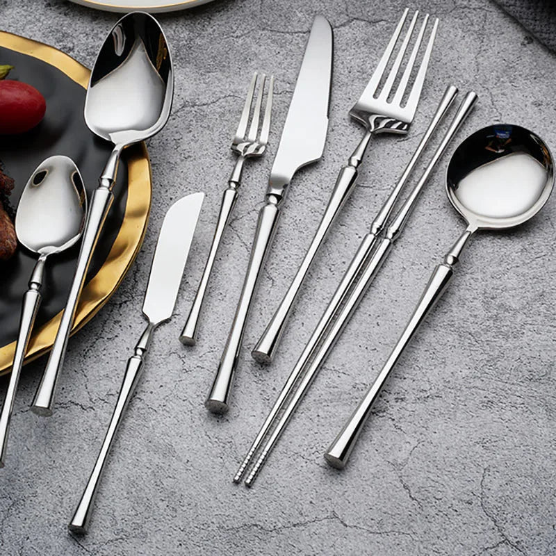 a small silverware set on a table