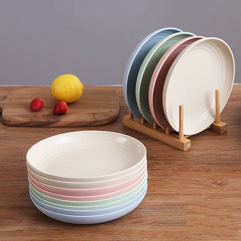 a stack of plates and a lemon on a wooden surface